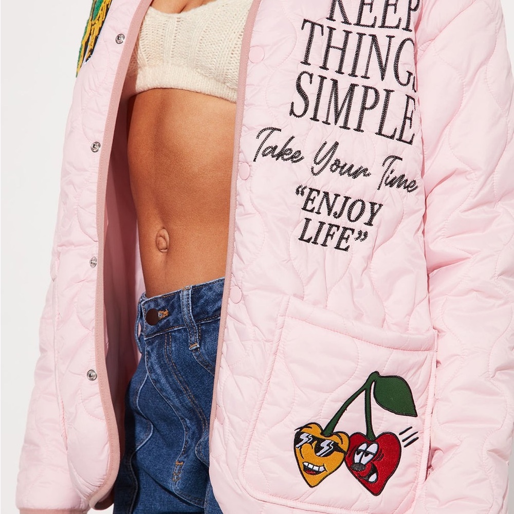 First Row - Pink Quilted Jacket with Graphic Text